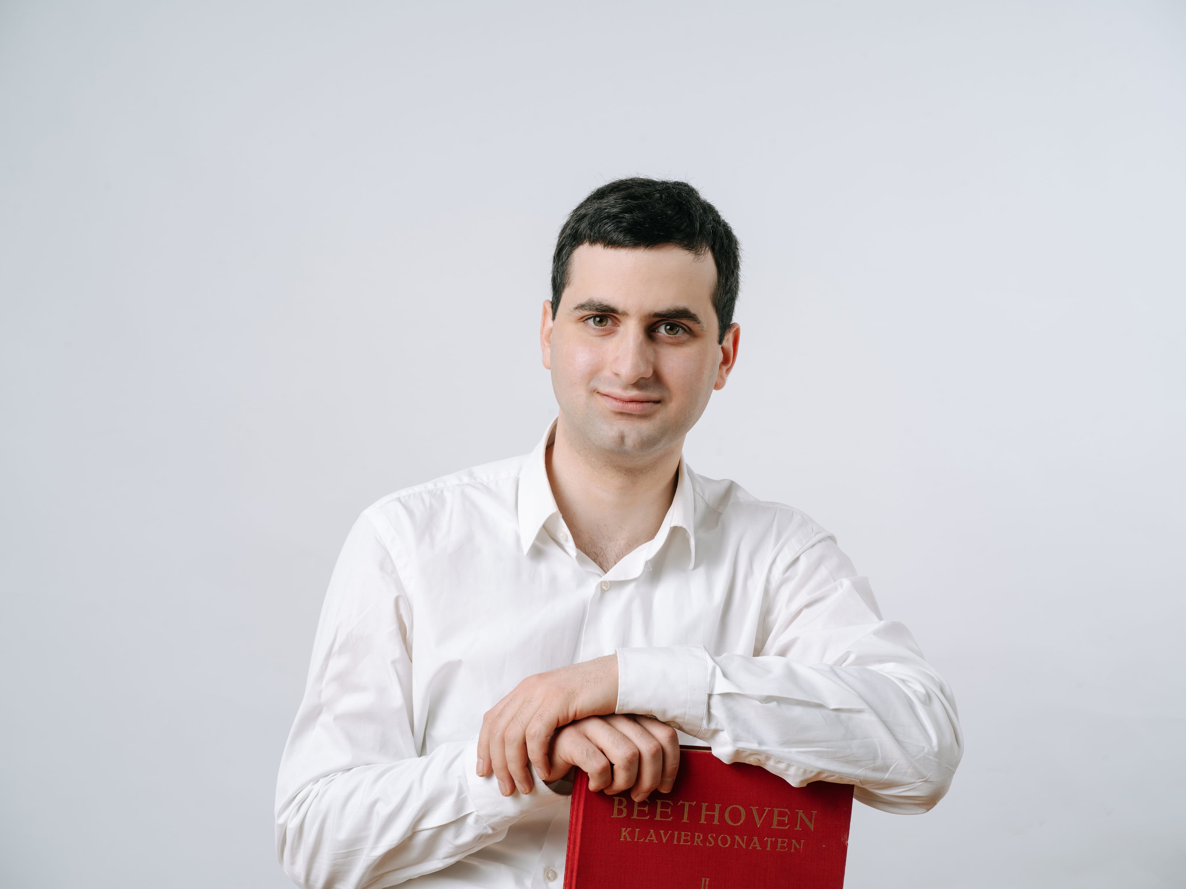 Image of sandro sitting and looking at camera